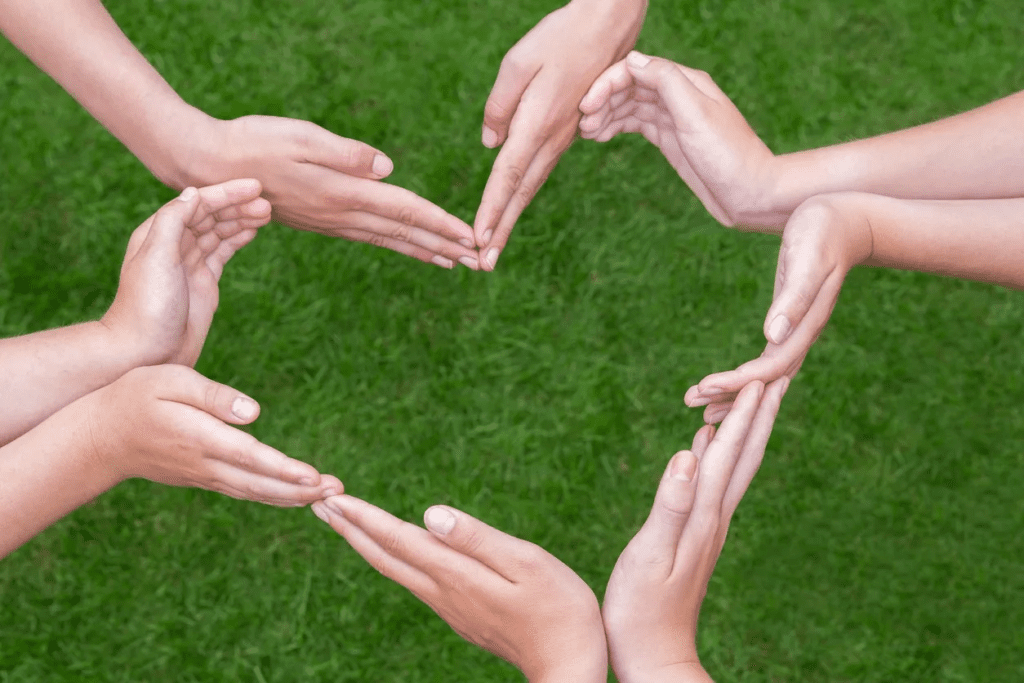 Eight Hands Put Together to Make a Heart Formation