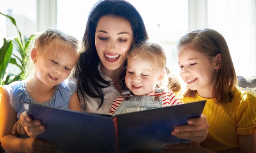 Mother Reading a Picture Book to Her Three Girls