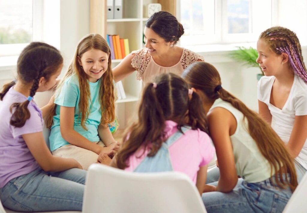 Female Counselor Leading a Group of Five Teen Girls