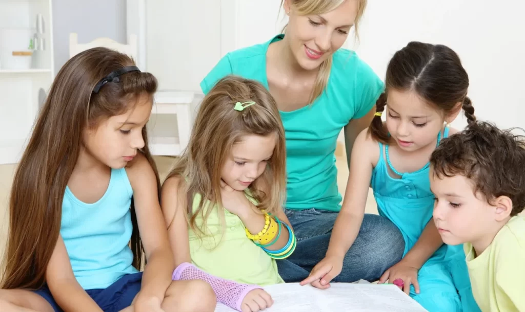 Mother Reading a Picture Book to her Four Children