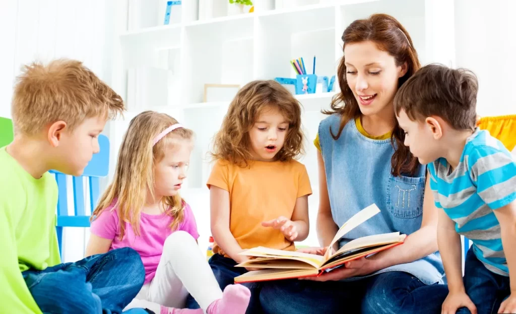 Mother Reading a Picture Book to her Four Children