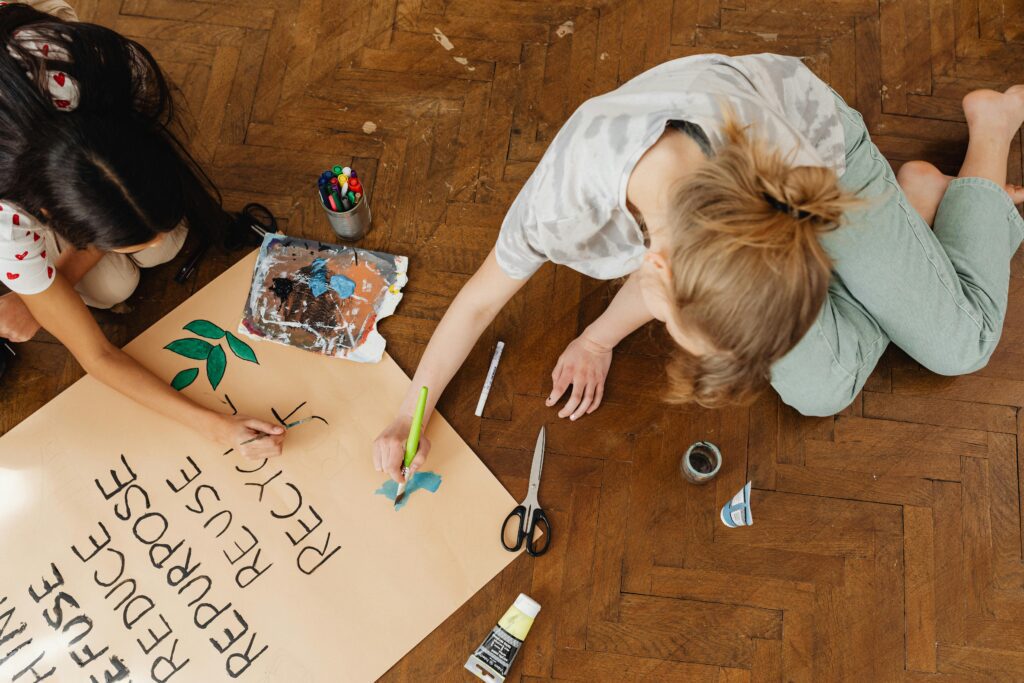 Two Girls Making a Poster