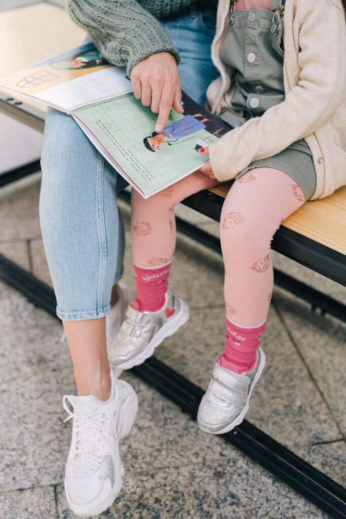 Mother and Daughter Reading a Picture Book Together