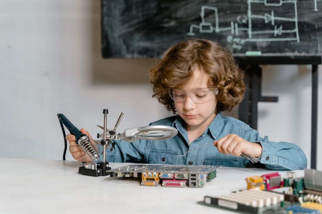 Boy Examining a System of Circuits Wearing Goggles