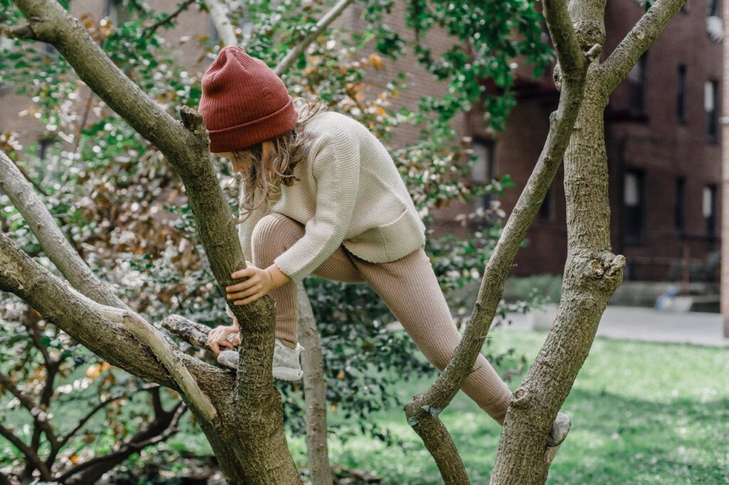 girl climbing tree